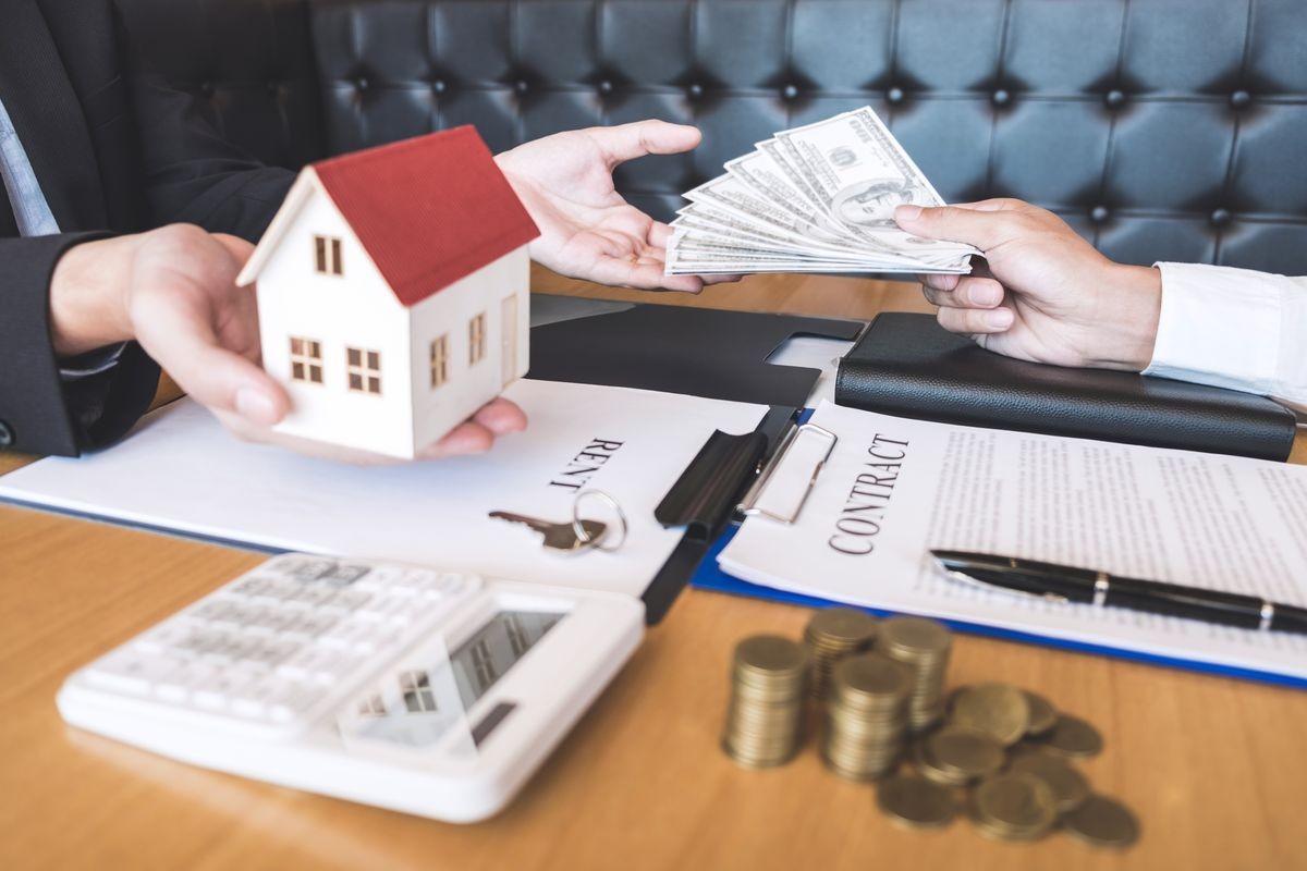 Estate agent broker receive money from client after signing agreement contract real estate with approved mortgage application form, buying or concerning mortgage loan offer for and house insurance.